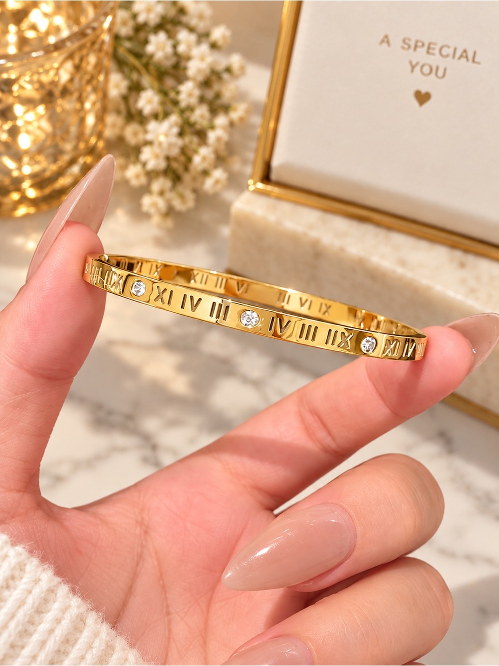 18K gold-plated stainless steel bangle bracelet. Luxury inspired Roman Numeral